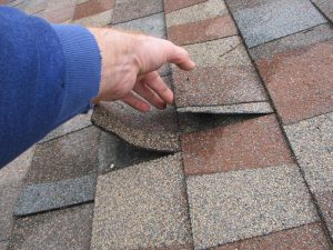 New roof shingles with defective tar strips